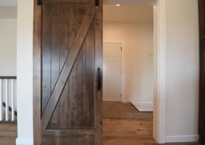 View of sliding barn door that leads to kitchen
