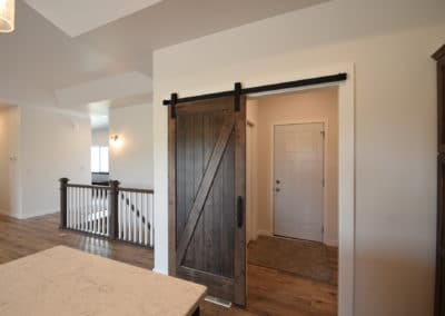 View of sliding barn door that leads to kitchen