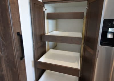 View of cabinet with slide out drawers