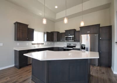 View of kitchen island, kitchen, cabinets, and countertops