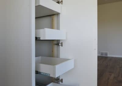 Cupboard with slide out storage drawers