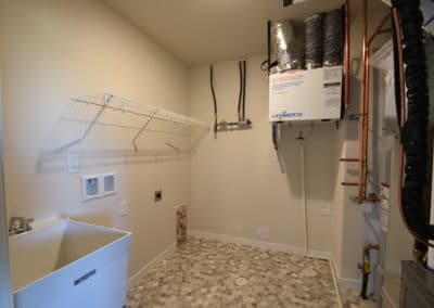 View of utility room sink and furnace